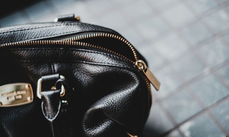 Close up of a black leather handbag
